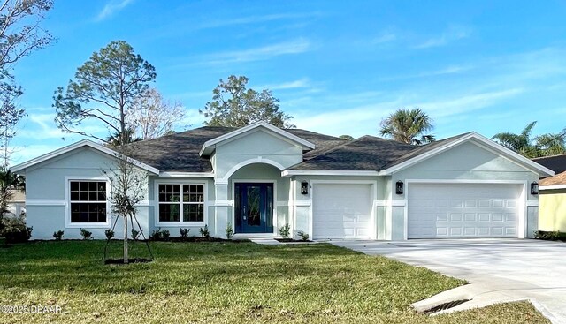 ranch-style home with a garage and a front yard