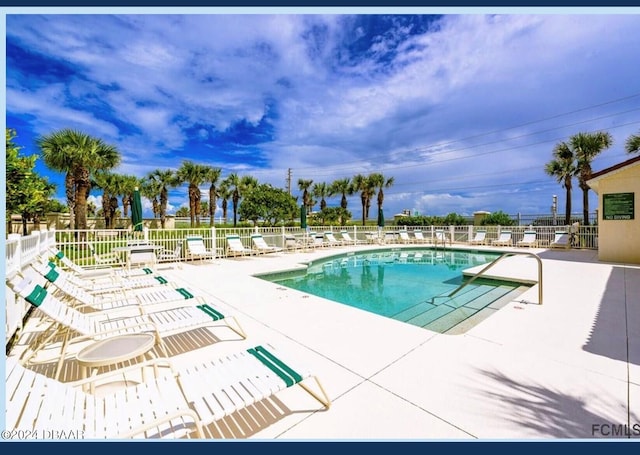 view of swimming pool featuring a patio