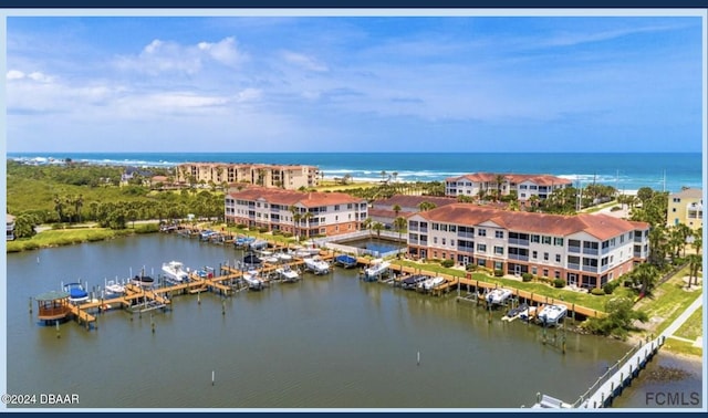 birds eye view of property with a water view