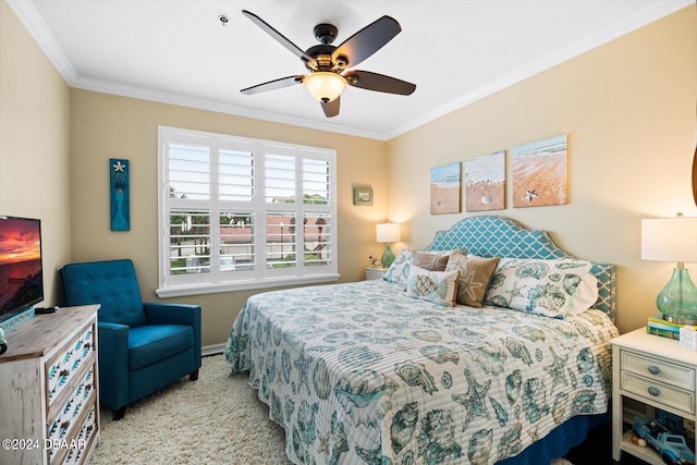 carpeted bedroom featuring ceiling fan and ornamental molding