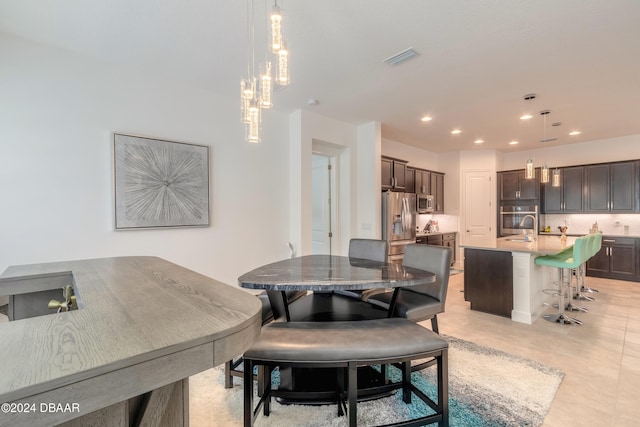 dining room with light tile patterned flooring