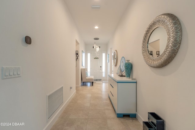 hallway featuring light tile patterned floors