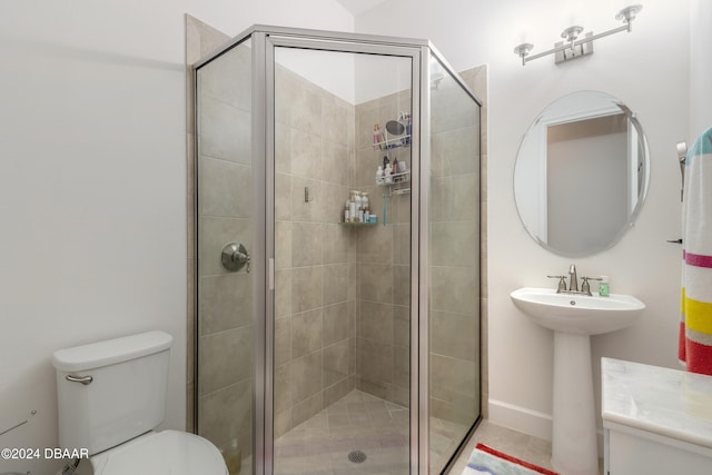 bathroom featuring toilet, an enclosed shower, and sink