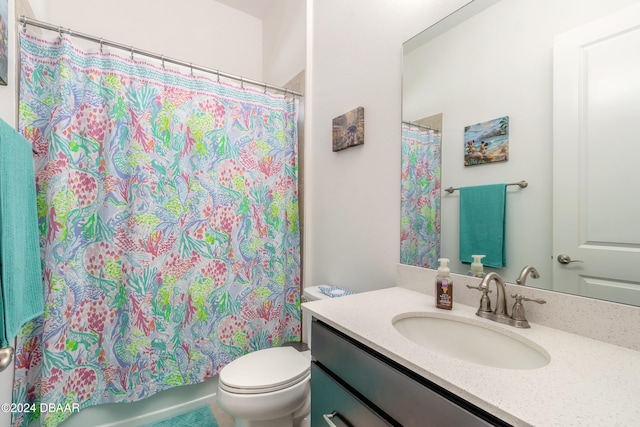 full bathroom with toilet, vanity, and shower / bath combination with curtain