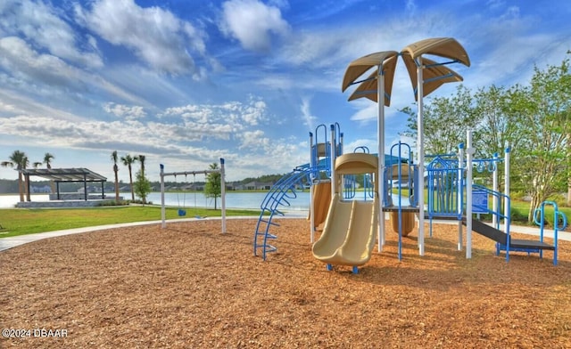 view of jungle gym featuring a water view