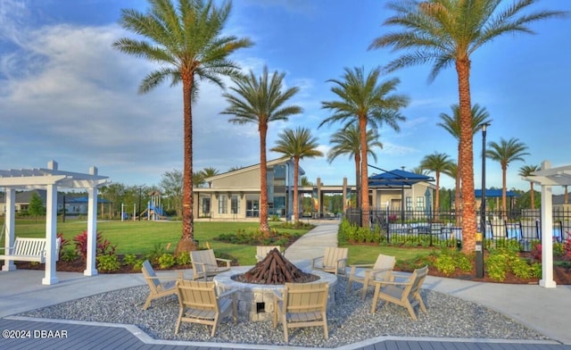 view of patio with a fire pit and a pergola