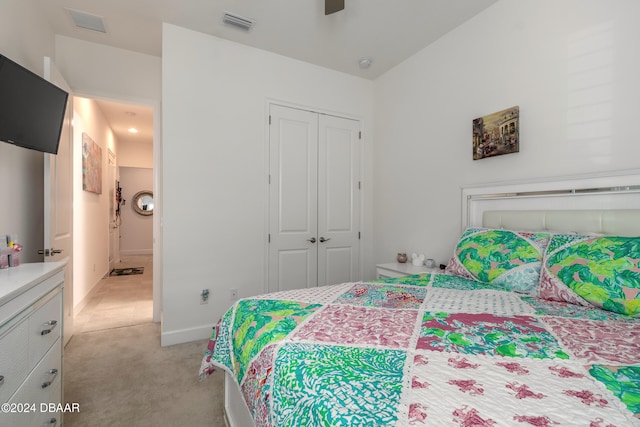 carpeted bedroom with a closet