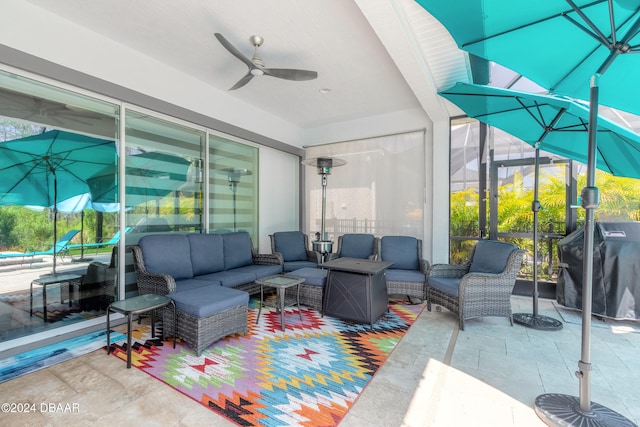 view of patio with outdoor lounge area, area for grilling, and ceiling fan