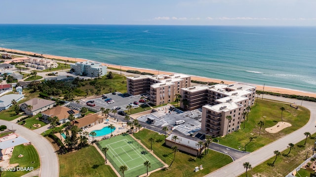 aerial view with a water view and a view of the beach