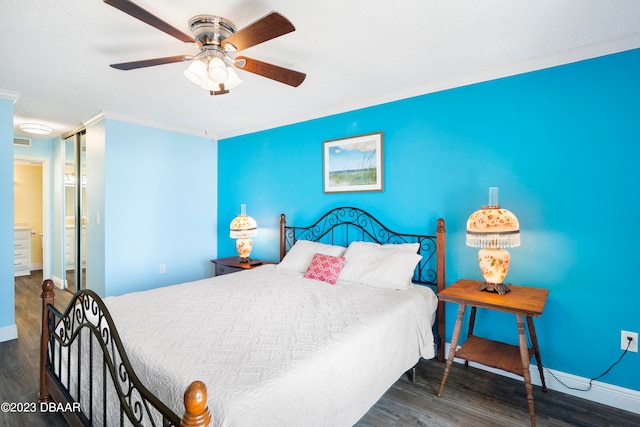 bedroom featuring ceiling fan, crown molding, and dark hardwood / wood-style flooring