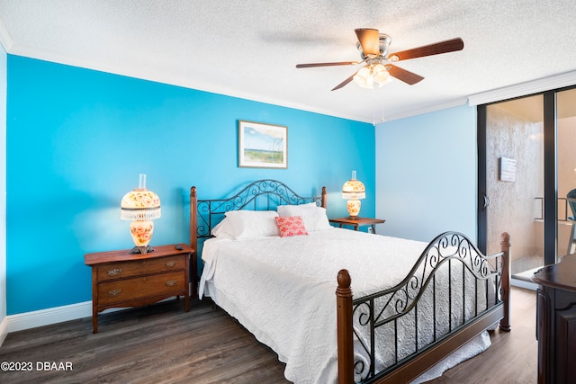 bedroom with ceiling fan, dark hardwood / wood-style floors, a textured ceiling, and crown molding