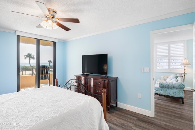 bedroom with access to outside, crown molding, a textured ceiling, dark hardwood / wood-style floors, and ceiling fan