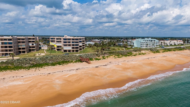 drone / aerial view with a view of the beach and a water view