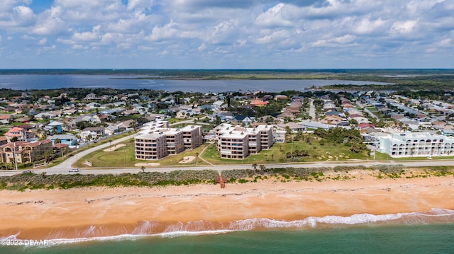 drone / aerial view with a view of the beach and a water view