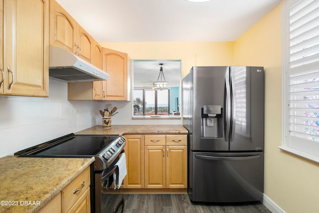 kitchen featuring light stone counters, stainless steel appliances, dark hardwood / wood-style flooring, light brown cabinetry, and hanging light fixtures