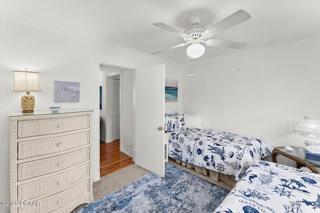 2667 John Anderson Dr, Ormond Beach, FL 32176 - carpeted bedroom featuring ceiling fan and crown molding
