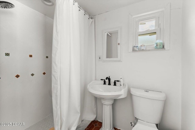 2667 John Anderson Dr, Ormond Beach, FL 32176 - bathroom featuring a stall shower and toilet