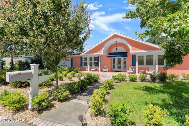 2667 John Anderson Dr, Ormond Beach, FL 32176 - view of front of property featuring french doors and stucco siding