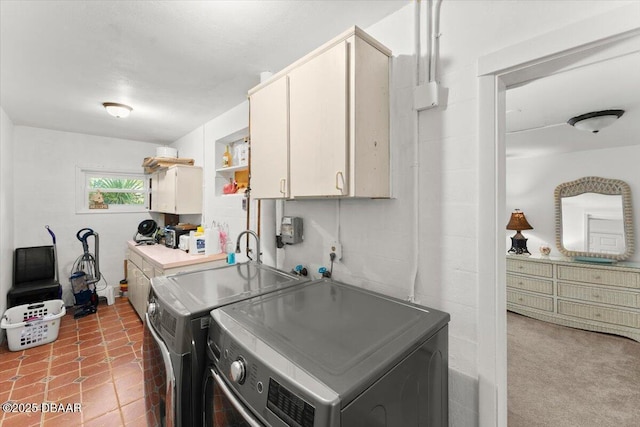 2667 John Anderson Dr, Ormond Beach, FL 32176 - laundry room featuring cabinet space and washing machine and clothes dryer