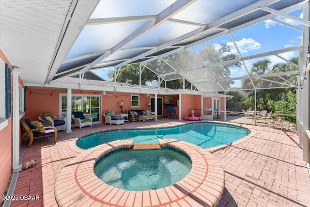 2667 John Anderson Dr, Ormond Beach, FL 32176 - view of pool with outdoor lounge area, a patio area, a pool with connected hot tub, and glass enclosure