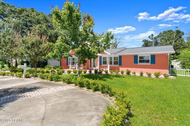 2667 John Anderson Dr, Ormond Beach, FL 32176 - ranch-style house featuring stucco siding and driveway