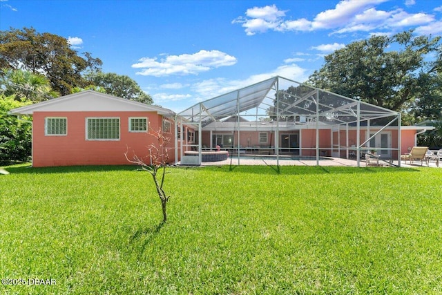2667 John Anderson Dr, Ormond Beach, FL 32176 - rear view of property featuring a yard, an outdoor pool, a patio, and a lanai