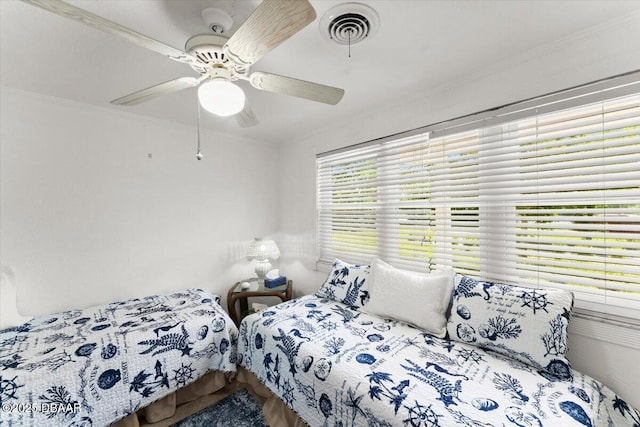 2667 John Anderson Dr, Ormond Beach, FL 32176 - bedroom featuring crown molding and ceiling fan