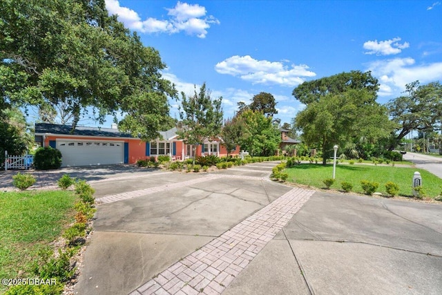 2667 John Anderson Dr, Ormond Beach, FL 32176 - obstructed view of property with a garage, driveway, and a front yard
