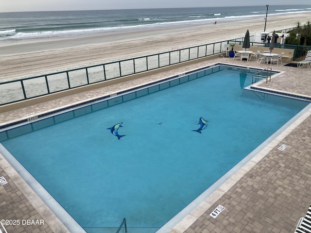 4555 S Atlantic Ave Unit 4209, Ponce Inlet, FL 32127 - community pool with view of water and beach and a patio