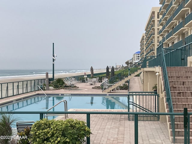 4555 S Atlantic Ave Unit 4209, Ponce Inlet, FL 32127 - community pool with stairway, a patio, and a water view
