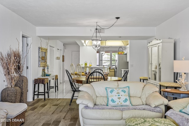 4555 S Atlantic Ave Unit 4209, Ponce Inlet, FL 32127 - living area with wood finished floors and a chandelier