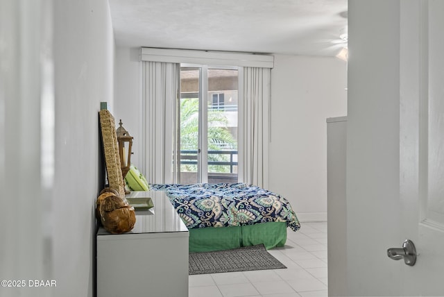 4555 S Atlantic Ave Unit 4209, Ponce Inlet, FL 32127 - bedroom with tile patterned flooring and multiple windows