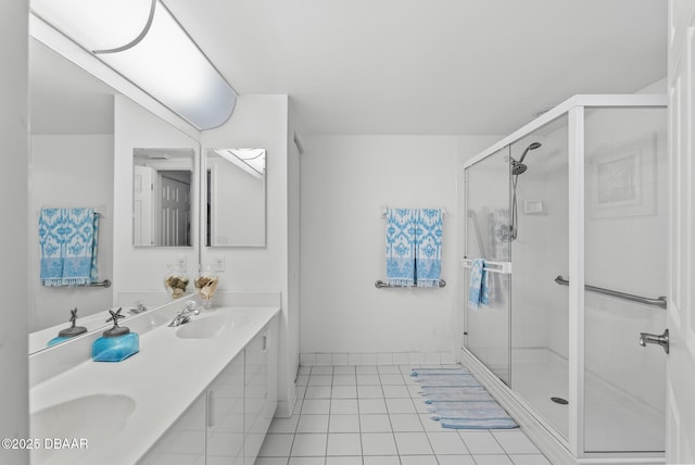 4555 S Atlantic Ave Unit 4209, Ponce Inlet, FL 32127 - bathroom with tile patterned floors, a shower stall, and double vanity