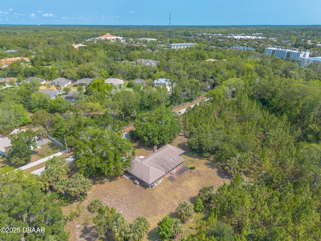 aerial overview of property's location featuring a forest