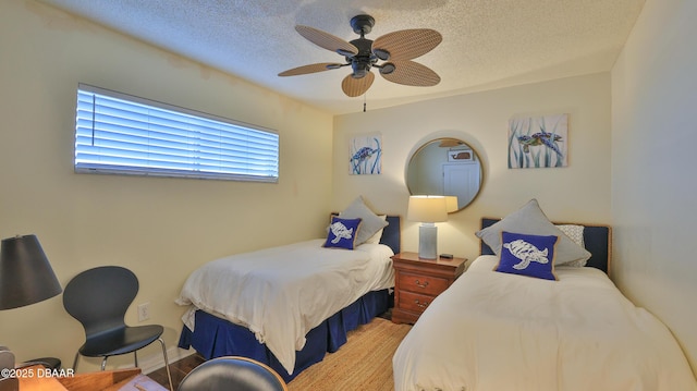 bedroom featuring ceiling fan and a textured ceiling