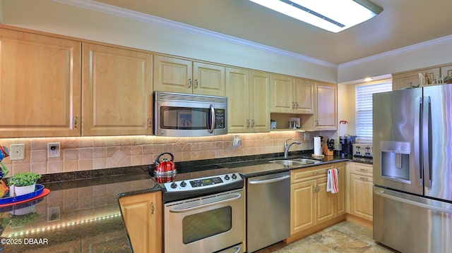 kitchen featuring stainless steel appliances, tasteful backsplash, dark stone countertops, crown molding, and sink