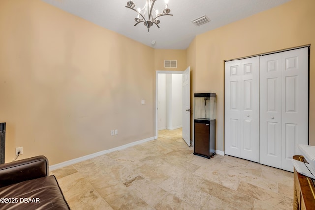 6 Promenade Pl, Palm Coast, FL 32164 - living area featuring a chandelier and baseboards