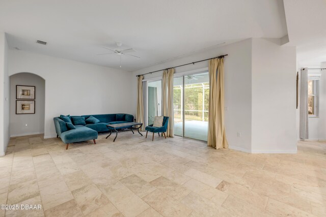 6 Promenade Pl, Palm Coast, FL 32164 - living area with a ceiling fan and arched walkways