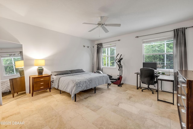 6 Promenade Pl, Palm Coast, FL 32164 - bedroom featuring an office area, light stone finish flooring, and ceiling fan