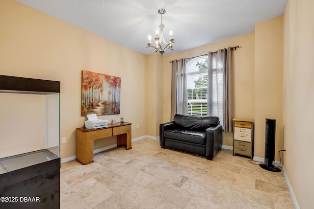 6 Promenade Pl, Palm Coast, FL 32164 - sitting room featuring a chandelier and baseboards