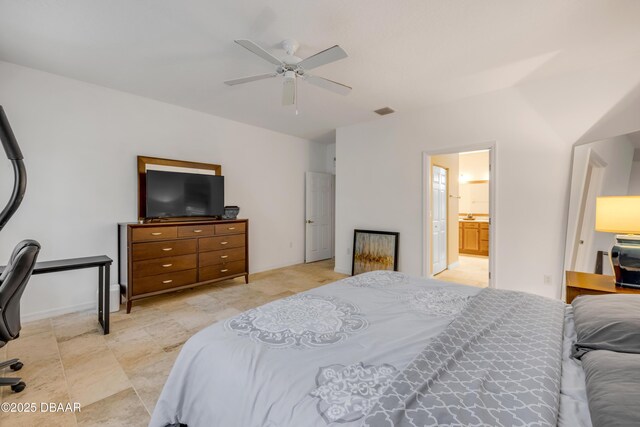 6 Promenade Pl, Palm Coast, FL 32164 - bedroom featuring connected bathroom, ceiling fan, and an office area