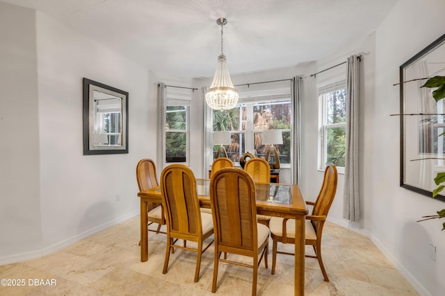 6 Promenade Pl, Palm Coast, FL 32164 - dining room with a chandelier and baseboards