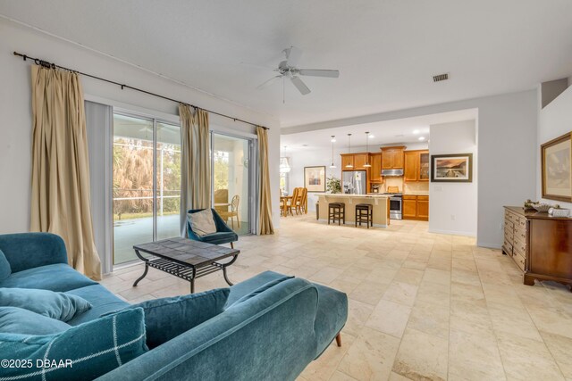 6 Promenade Pl, Palm Coast, FL 32164 - living area with ceiling fan and baseboards