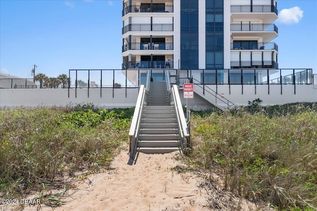 entrance to property with a balcony