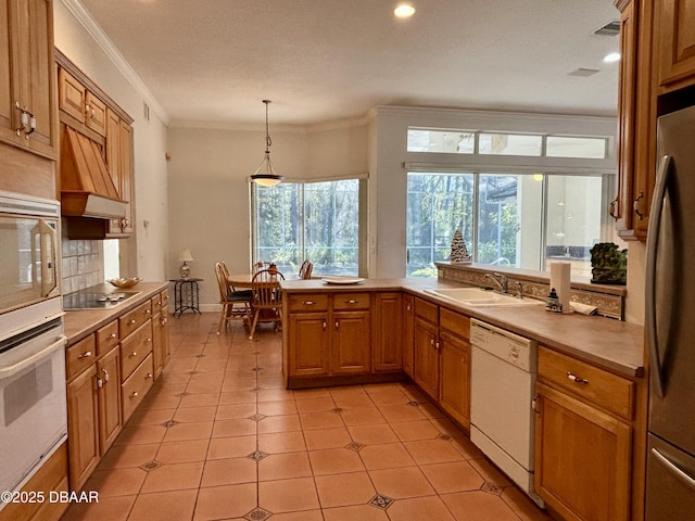 47 Elder Dr, Palm Coast, FL 32164 - kitchen featuring white appliances, a sink, premium range hood, plenty of natural light, and crown molding