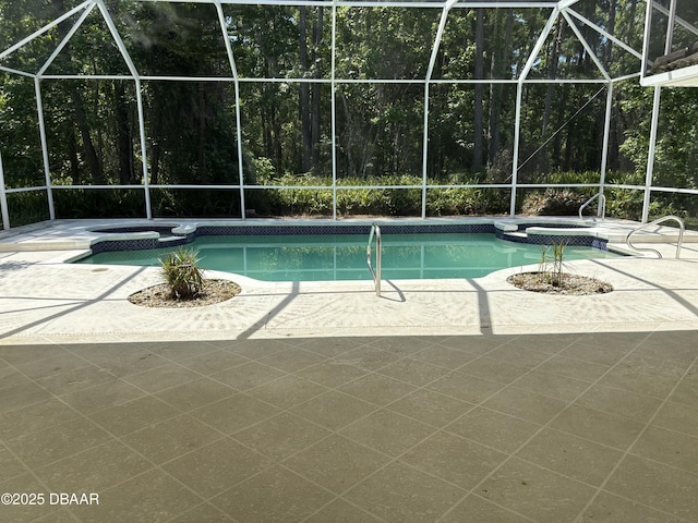 47 Elder Dr, Palm Coast, FL 32164 - view of swimming pool with a pool with connected hot tub, a patio, and a lanai