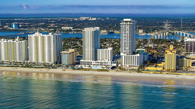 bird's eye view featuring a view of the beach and a water view