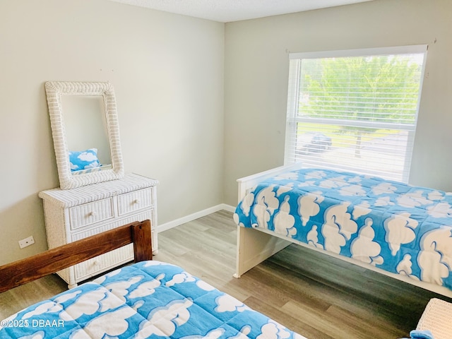 415 Banana Cay Dr Unit J, South Daytona, FL 32119 - bedroom with wood finished floors and baseboards