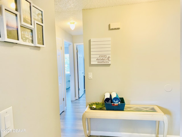 415 Banana Cay Dr Unit J, South Daytona, FL 32119 - corridor with a textured ceiling and wood finished floors