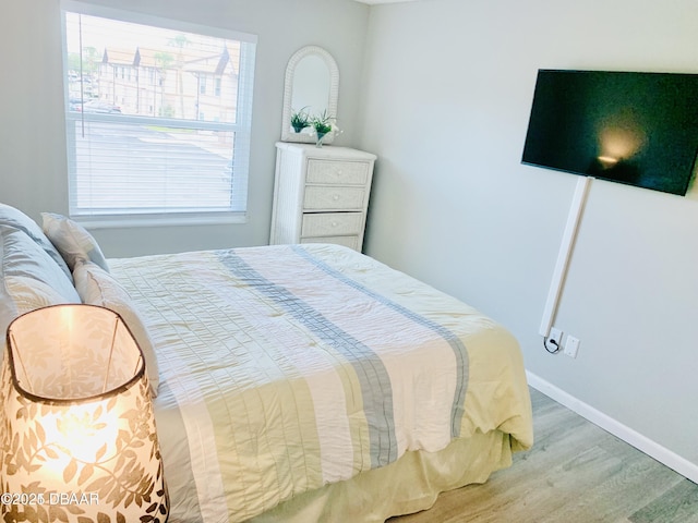 415 Banana Cay Dr Unit J, South Daytona, FL 32119 - bedroom featuring wood finished floors and baseboards